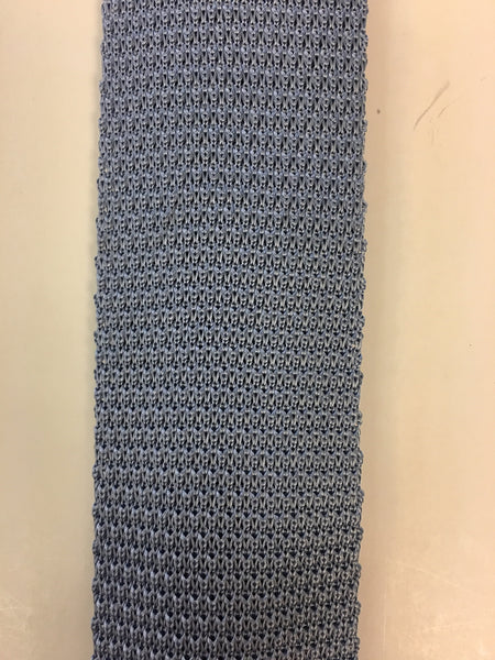 Close up of plain ice blue knitted silk tie