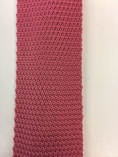 Close up of plain pink knitted silk tie